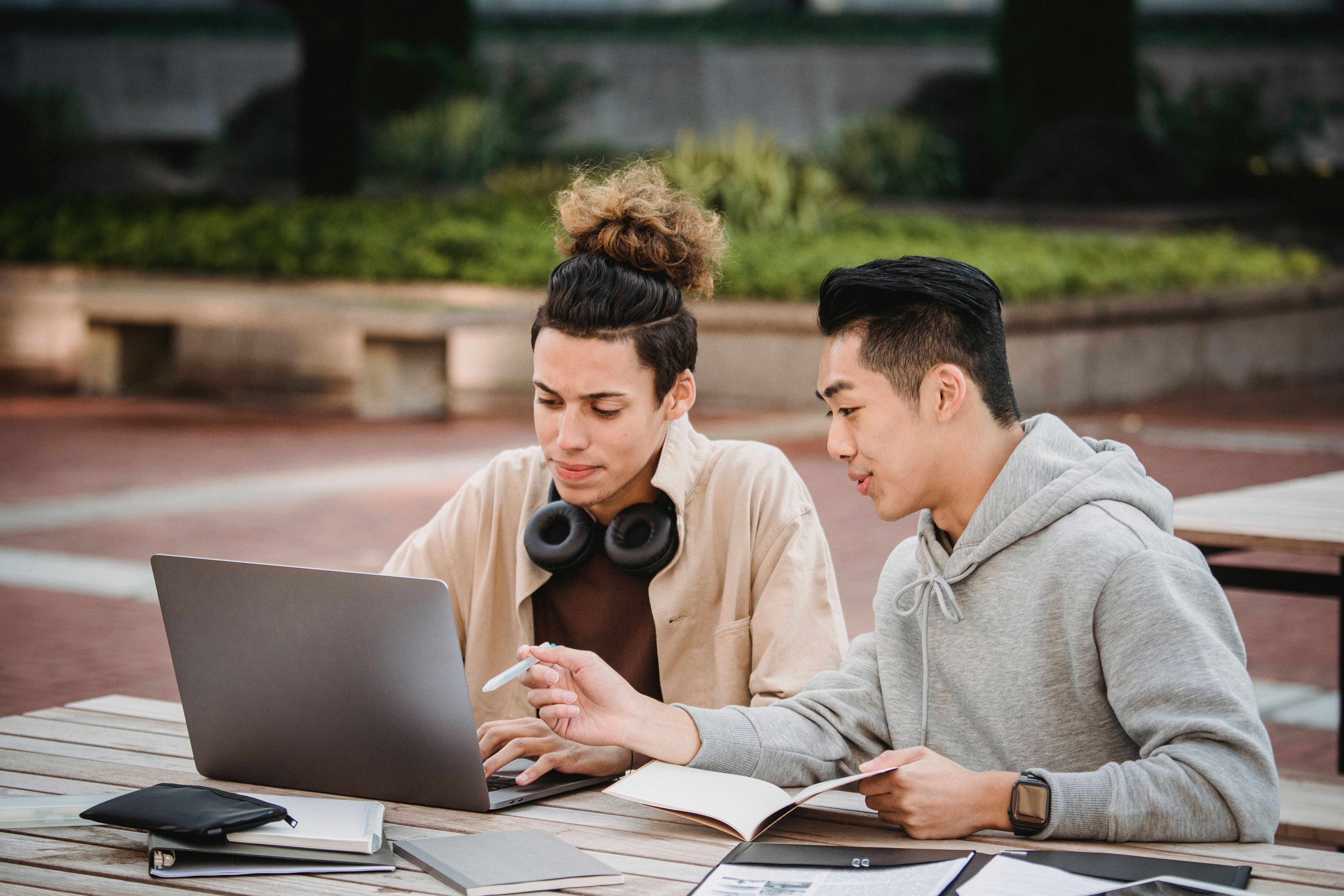 Students studying together with a laptop